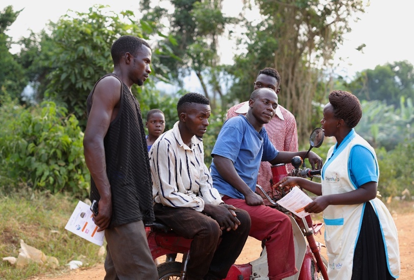 A Flying Nurse talks to youths in Ssekanyonyi sub-county, Mityana District.