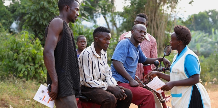 A Flying Nurse talks to youths in Ssekanyonyi sub-county, Mityana District.