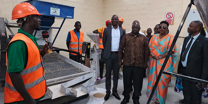 Assistant Commissioner Yafesi Ogwang (centre), Felix Opio, Phoebe Namulindwa, Fred Kasirye and other leaders listen to a youth explaining how the machines work