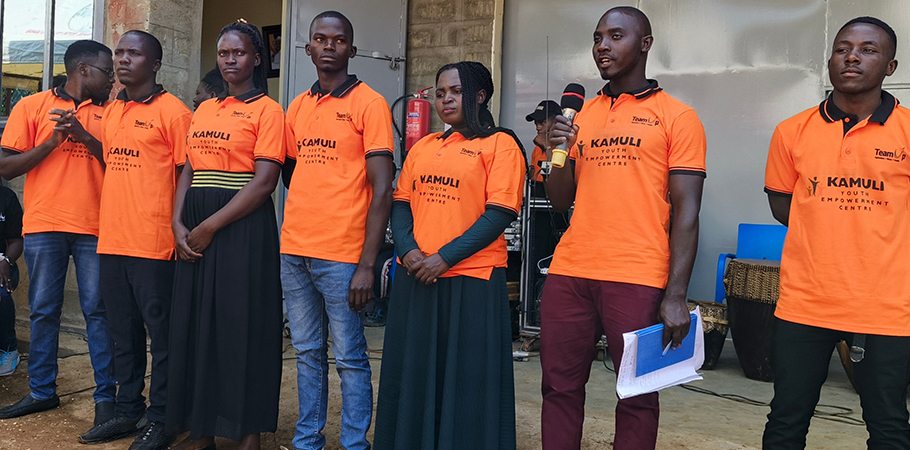 Henry Muyanja with members of the Executive Committee of Kamuli Youth Empowerment Centre.