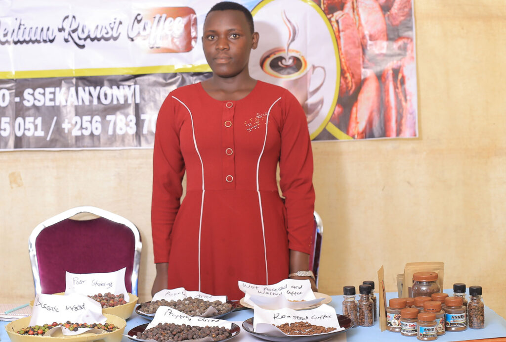 Caroline Nantambi exhibiting coffee value addition, a business she started with her fellow youth in Ssekanyonyi Subcounty, Mityana District.