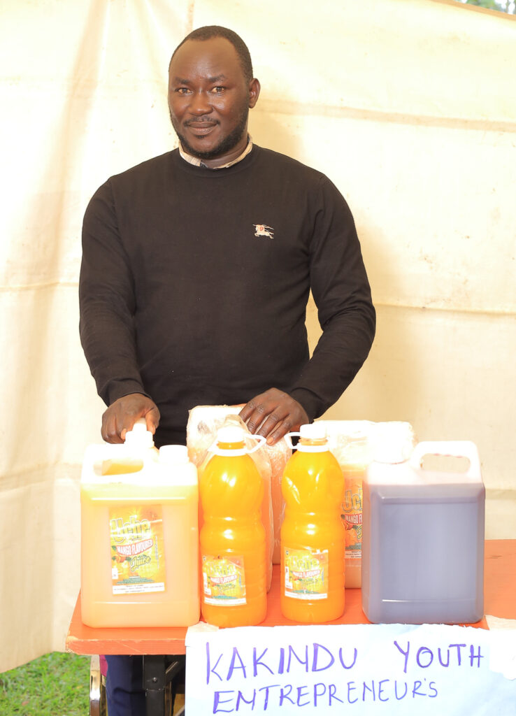 Julius Ceaser Atidriziea shows the fruit juice he produces as a business